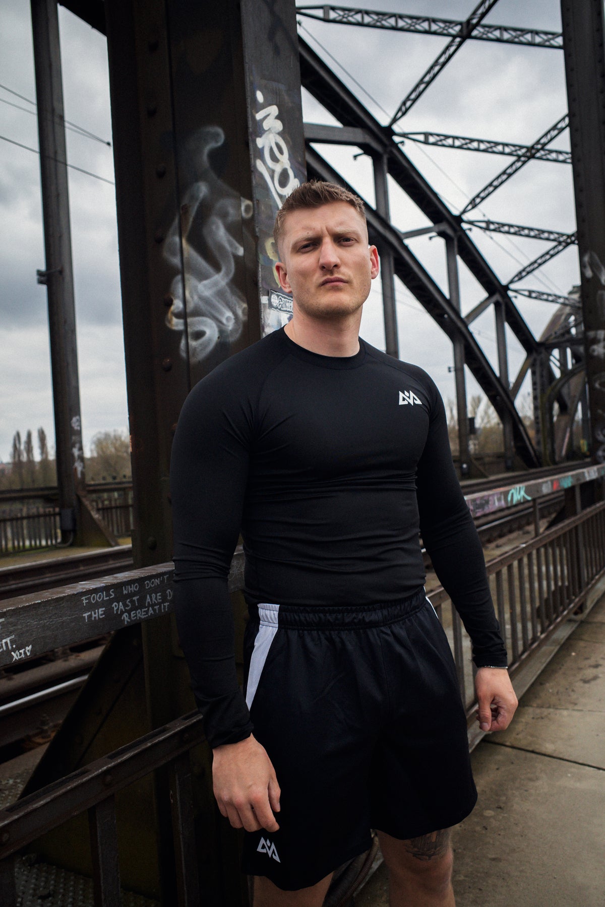 Black long-sleeve shirt with geometric chest logo