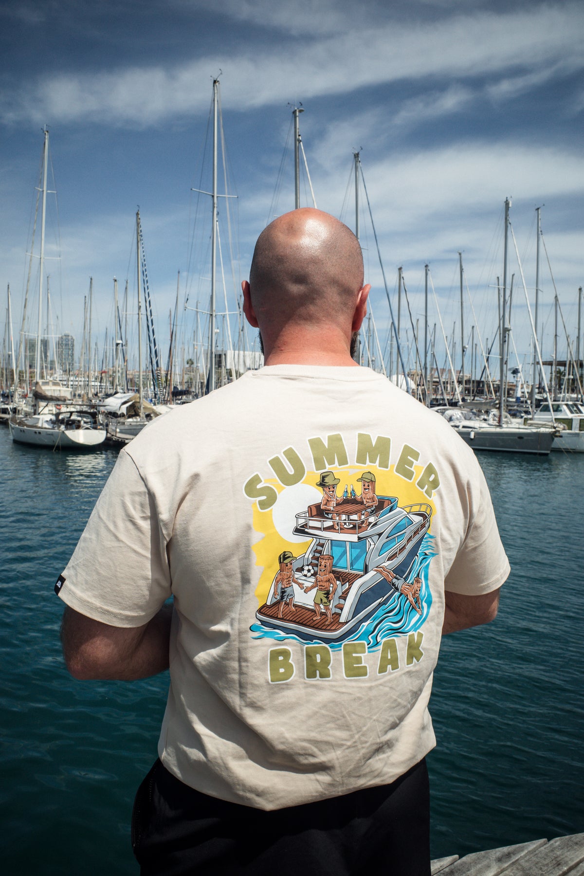 Detailed back print of cartoon bread figures on yacht with Summer Break text