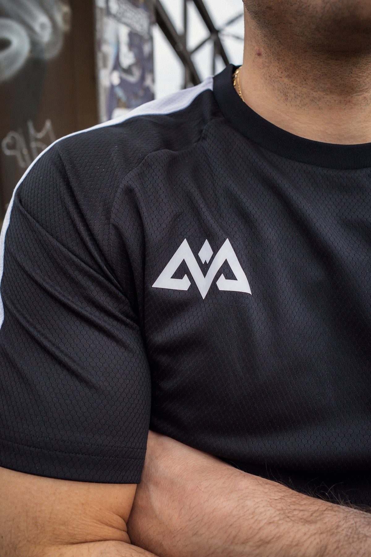 Macro view of geometric logo and honeycomb texture on black t-shirt