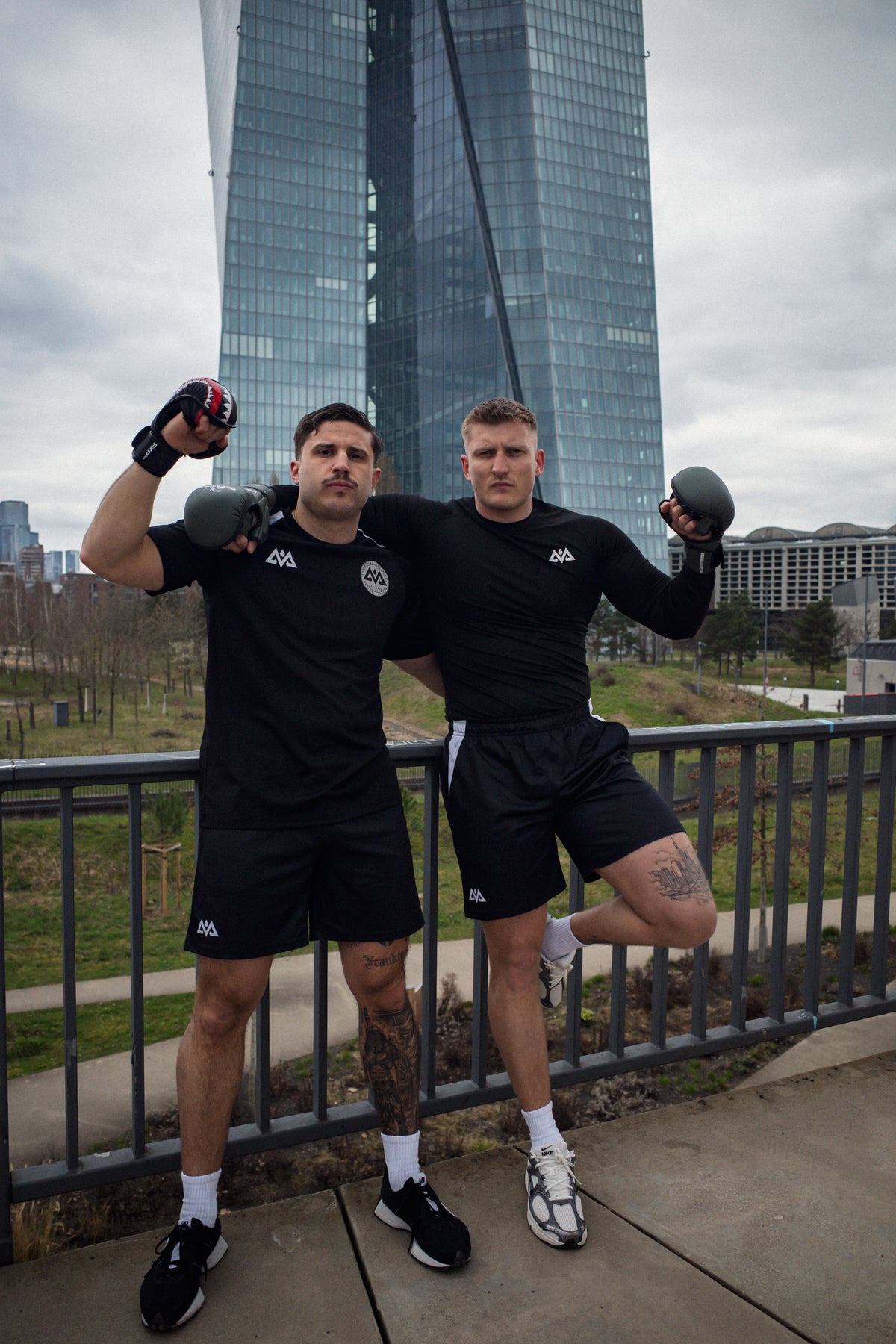 Men wearing black technical mesh t-shirts with white AV logos