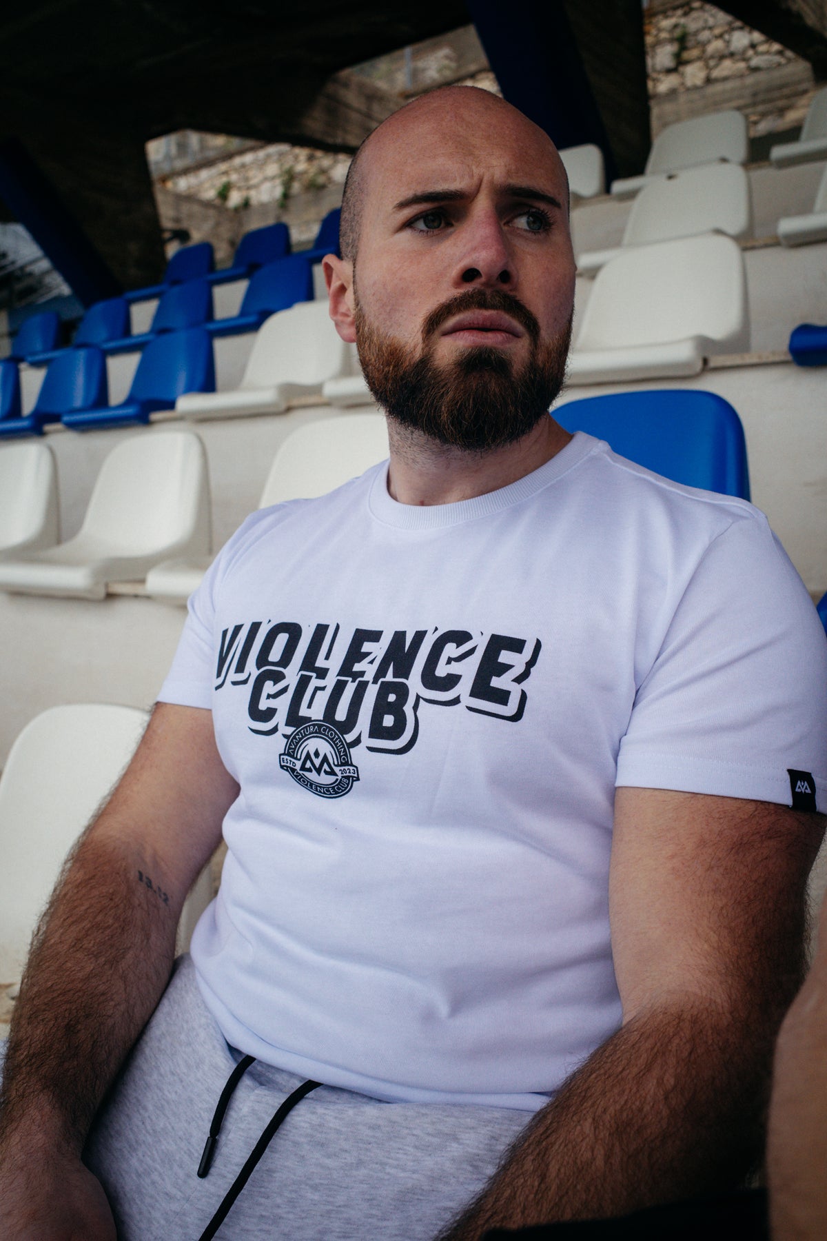 White Violence Club frontprint T-shirt with black chest graphic and sleeve label